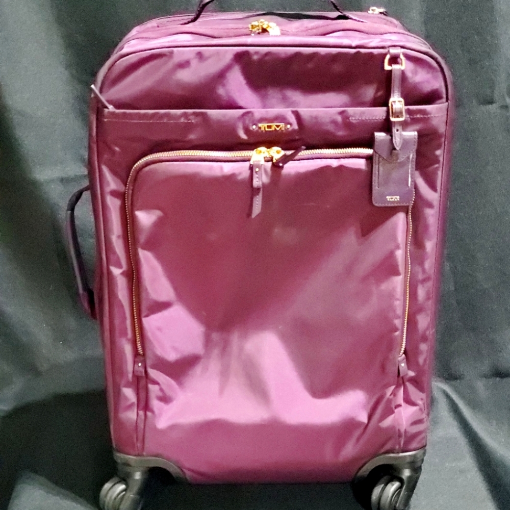 Tumi Voyageur Leger carry-on eggplant/plum color, 4 wheels telescoping handle